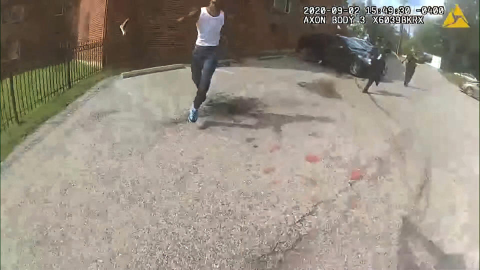 This image from video released by the Metropolitan Police Department, shows body cam video during a foot pursuit with Deon Kay, center, in Washington, on Wednesday afternoon, Sept. 2, 2020. Police in the nation’s capital released body camera footage from the officer who fatally shot the Black 18-year-old in the chest. (Metropolitan Police Department via AP)