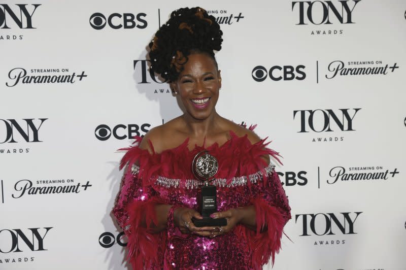 Kecia Lewis, recipient of the Best Performance by an Actress in a Featured Role in a Musical award for "Hell's Kitchen", holds her Tony Award in the press room at the David H. Koch Theater at Lincoln Center for the Performing Arts on Sunday in New York City. Photo by Peter Foley/UPI