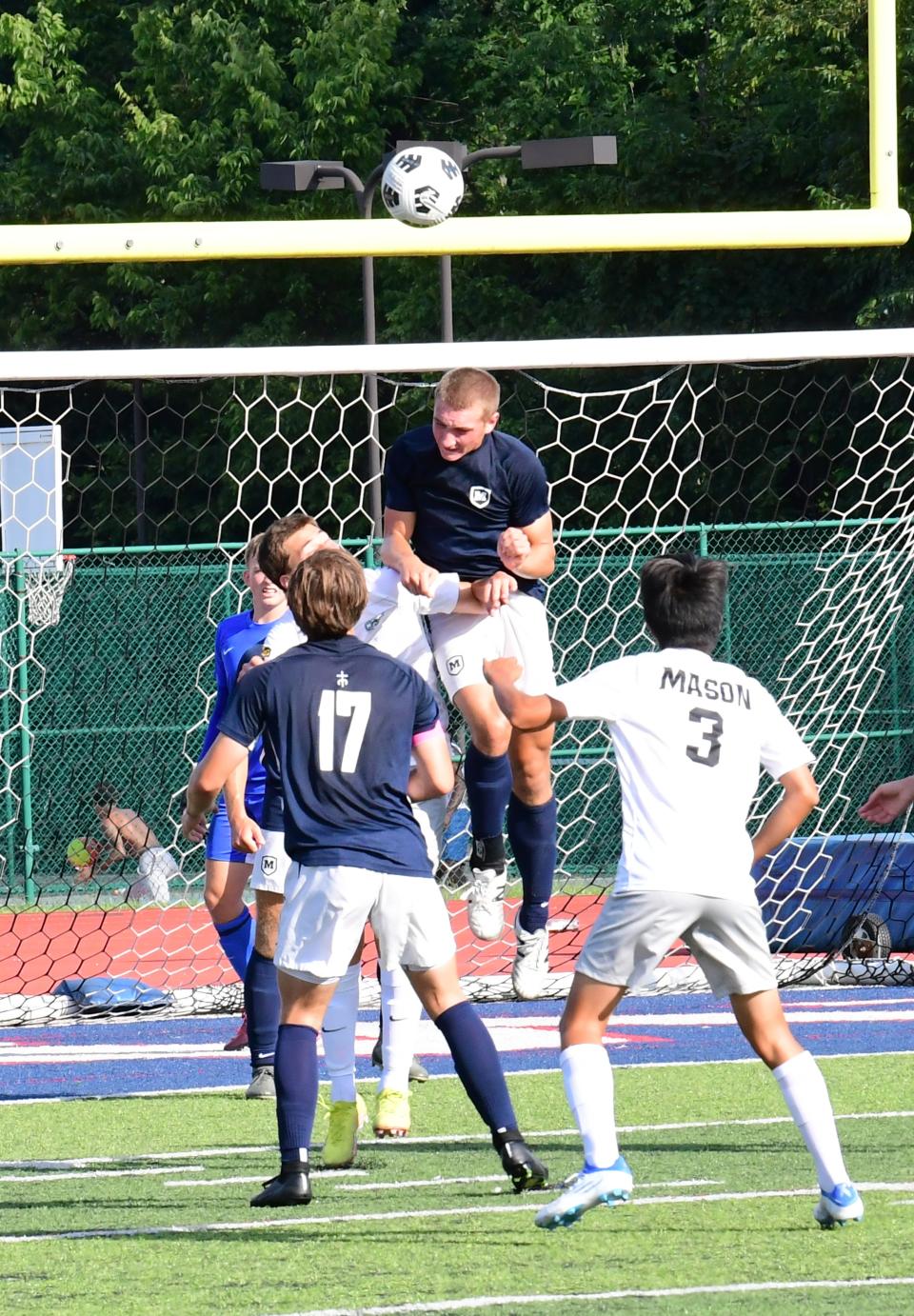 Moeller's Maddox Miller, shown defending the goal with a header, has been voted one of the top boys soccer players in Ohio in 2023.