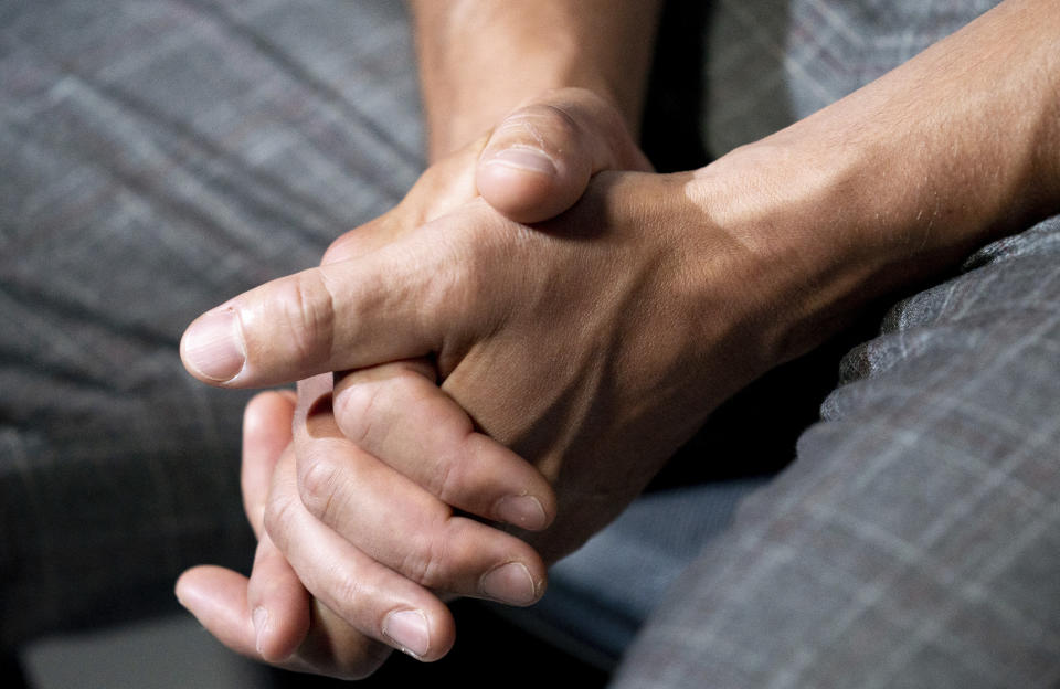 Boxer Gennadiy Golovkin, of Kazakhstan, clasps his hands during an interview with The Associated Press, Tuesday, June 28, 2022, in New York. Golovkin and Canelo Álvarez, of Mexico, will meet for a third time on Sept. 17, 2022, in Las Vegas. (AP Photo/Julia Nikhinson)