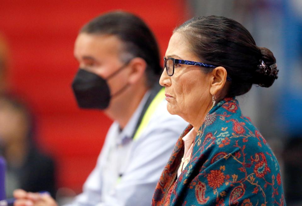 Interior Secretary Deb Haaland and Assistant Secretary for Indian Affairs Bryan Newland listen to a testimony during the first stop on a U.S. listening tour to hear from students who attended Native American boarding schools at the Riverside Indian School in Anadarko, Okla., Saturday, July, 9, 2022.