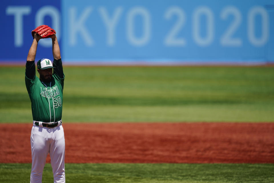 Mexico's Manuel Barrera stretches while pitching during a baseball game against Israel at Yokohama Baseball Stadium during the 2020 Summer Olympics, Sunday, Aug. 1, 2021, in Yokohama, Japan. (AP Photo/Matt Slocum)