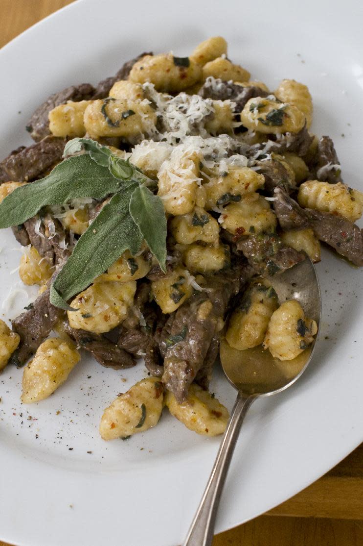 In this image taken on Feb. 27, 2012, a 15-minute seared bison with sage and gnocchi is shown in Concord, N.H. (AP Photo/Matthew Mead)