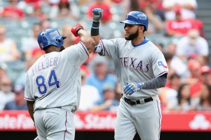 Nomar Mazara (right) homered in his first game with the Rangers. (Getty Images)