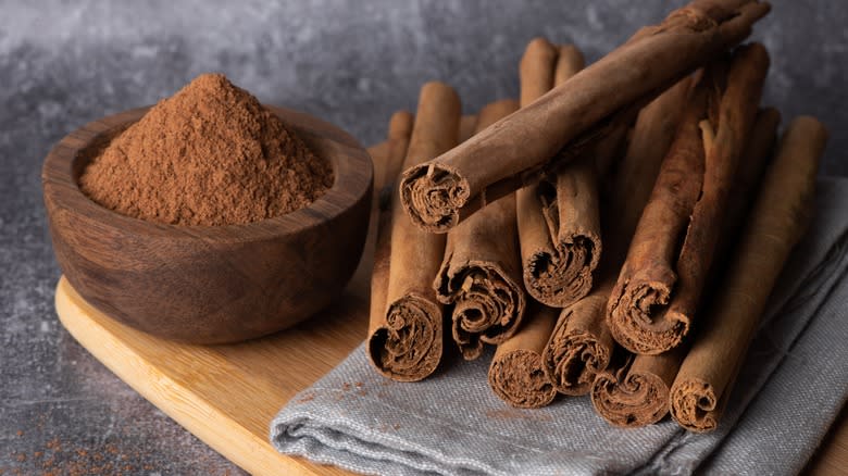 cinnamon sticks on wooden background