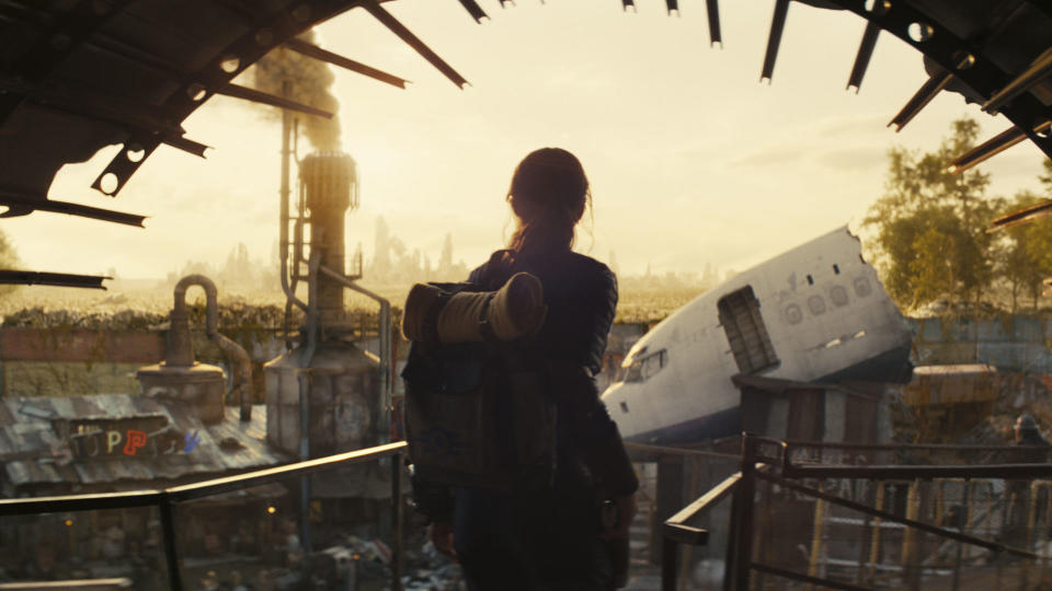 A silhouetted Lucy emerges from Vault 33 in Prime Video's Fallout TV show