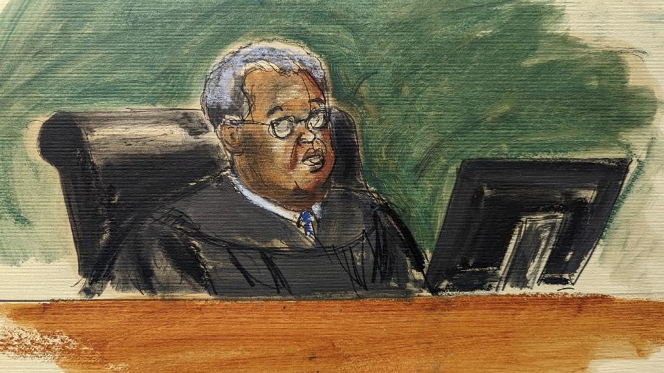 In this courtroom sketch, William F. Kuntz, United States District Judge addresses Magali Anderson, Chief Sustainability and Innovation Officer of Holcim, in Brooklyn Federal Court, Tuesday, Oct. 18, 2022, in New York. French cement company Lafarge pleaded guilty Tuesday to paying millions of dollars to the Islamic State group in exchange for permission to keep open a plant in Syria, a case the Justice Department described as the first of its kind. The company also agreed to penalties totaling roughly $778 million. The wrongdoing precedes Lafarge’s merger with Holcim in 2015. (Elizabeth Williams via AP)