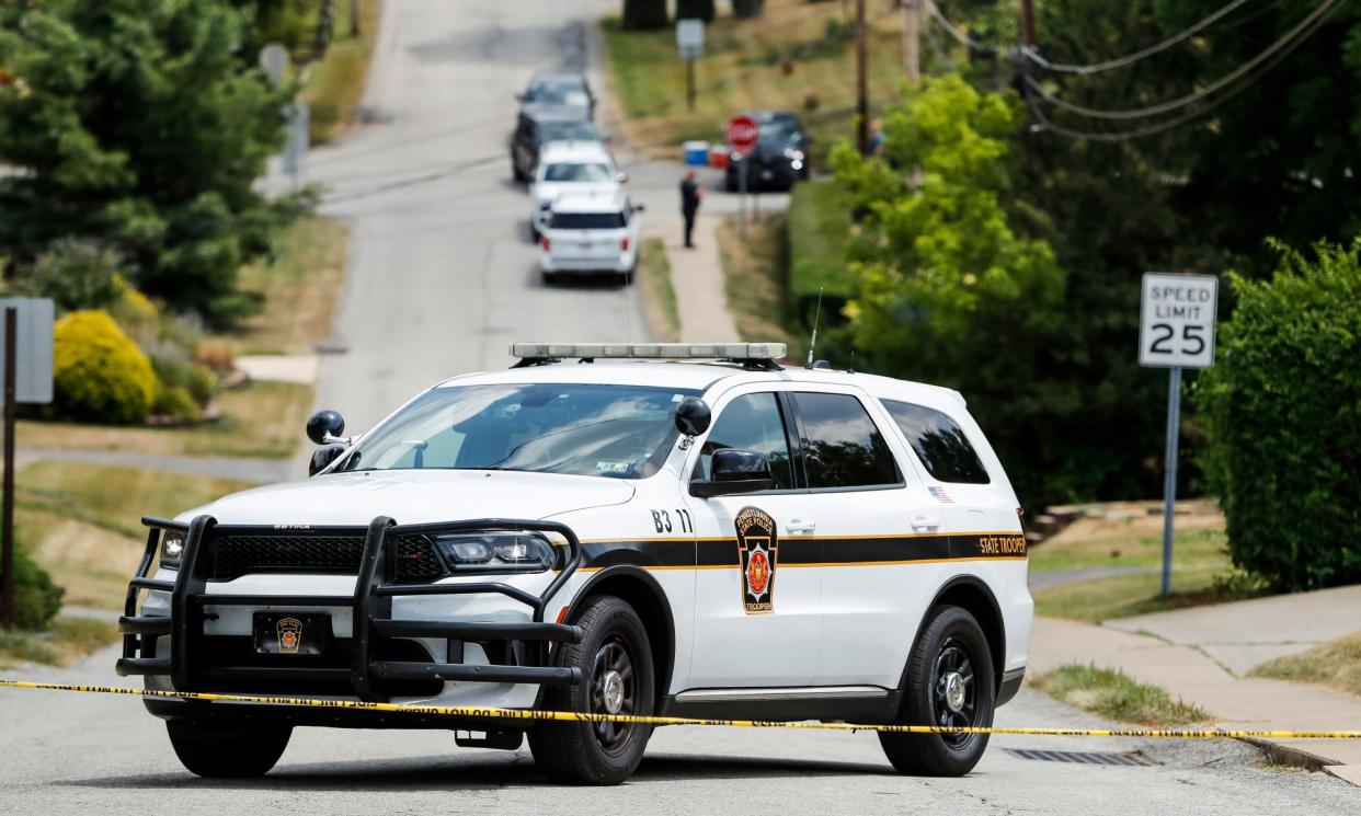 <span>Law enforcement officials near the home the suspected gunman who shot Donald Trump at a Pennsylvania rally.</span><span>Photograph: David Maxwell/EPA</span>