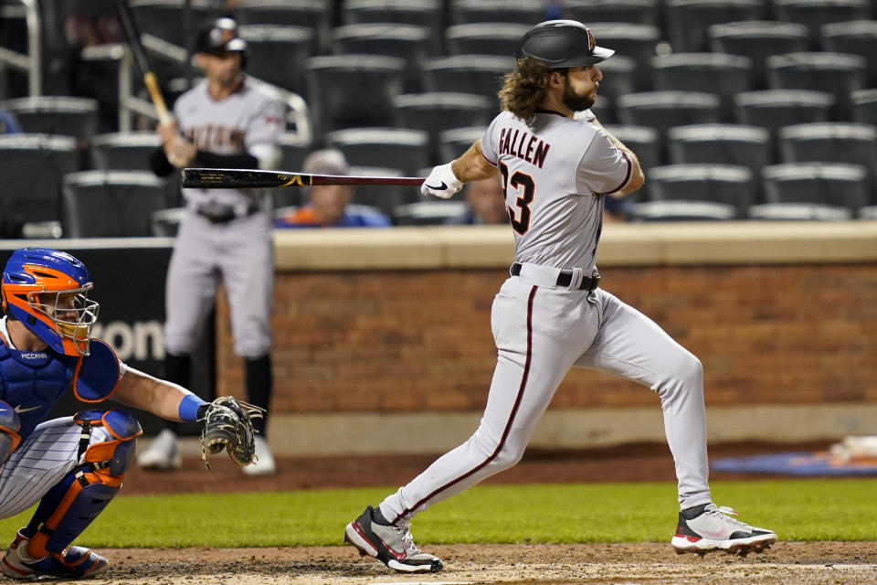 Arizona Diamondbacks' Zac Gallen follows through on a ground ball off New York Mets relief pitcher Robert Gsellman, driving in a run during the third inning of a baseball game, Friday, May 7, 2021, in New York. A runner was forced at second on the play. (AP Photo/John Minchillo)