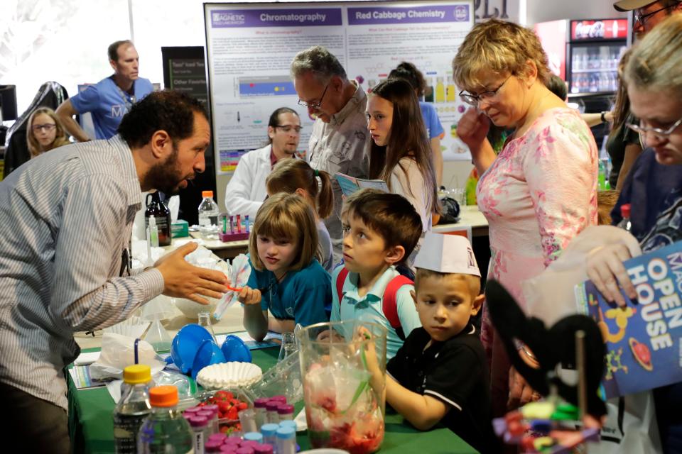 Nina Ozerova, 7, Russell Duglas, 8, and Anton Ozerova, 5, learn about DNA extraction. Hundreds attend the MagLab open house to learn about science in 2019. The 2024 open house will be Saturday, Feb. 24.