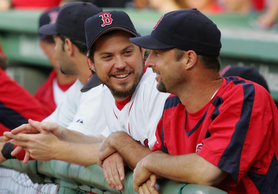 BOSTON - JUNE 27: Josh Beckett #19 (L) and Tim Wakefield #49 of the Boston Red Sox have a laugh before playing the New York Mets on June 27, 2006 at Fenway Park in Boston, Massachusetts. (Photo by Jim McIsaac/Getty Images) 