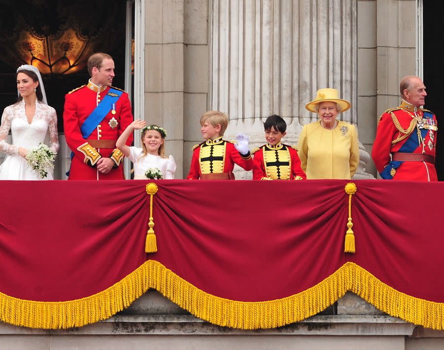 The British royal beams from the balcony of Buckingham Palace while celebrating the marriage of her grandson, Prince William to Kate Middleton at the Royal Wedding on April 29, 2011.