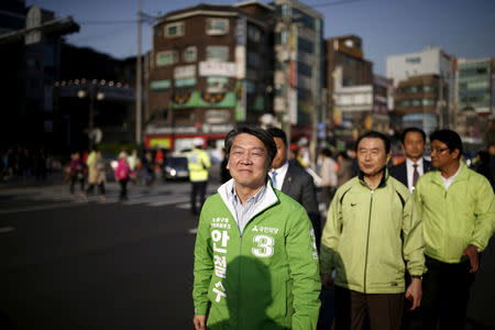 Ahn Cheol-soo, People's Party co-chairman, arrives for a rally for the April 13 parliamentary elections in Seoul, South Korea, April 11, 2016. REUTERS/Kim Hong-Ji/File Photo