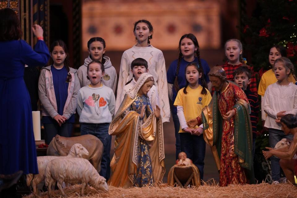 Children from St Mary's Ukrainian Choir during a rehearsal (PA)