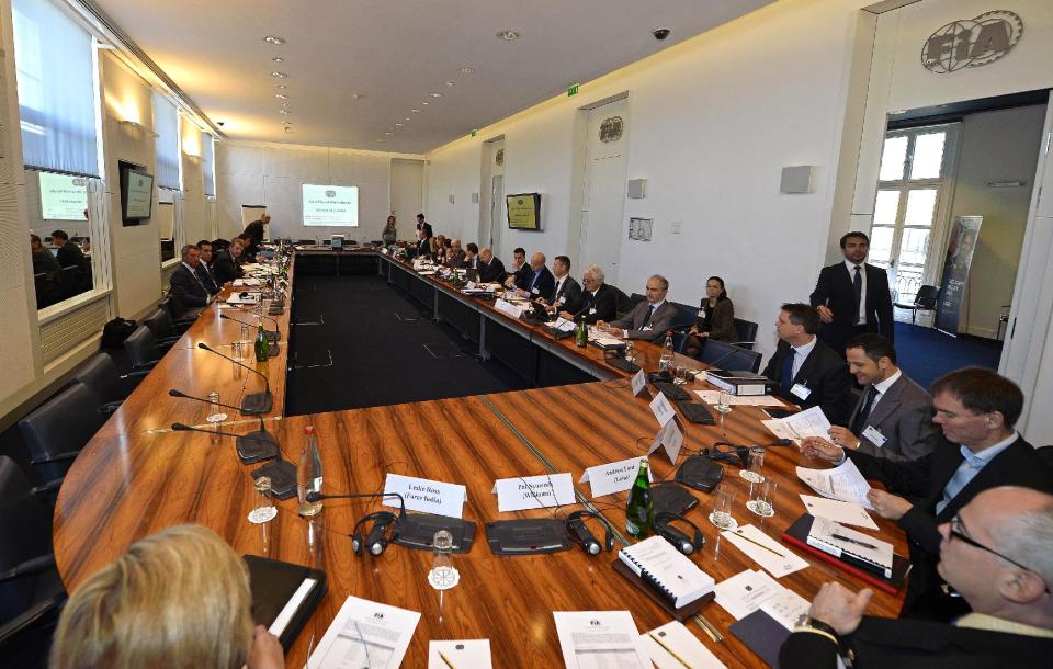 Members of the International Automobile Federation (FIA) Appeal Court gather for a hearing, Paris, Monday, April 14, 2014. The dispute resolution tribunal for motorsport is hearing Red Bull's case against the disqualification of Daniel Ricciardo from the Australian Grand Prix. (AP Photo/Eric Vargiolu, Pool)