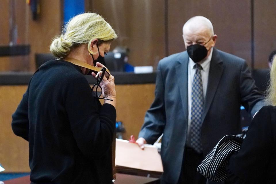 Tracey Kay McKee, left, is shown in court with her defense lawyer Tom Henze on Wednesday, March 2, 2022 in Phoenix. A judge in Phoenix on Friday, April 29, 2022 sentenced Tracey Kay McKee, who now lives in California to two years' felony probation, fines and community service for voting her dead mother's ballot in the 2020 general election.(AP Photo/Ross D. Franklin)