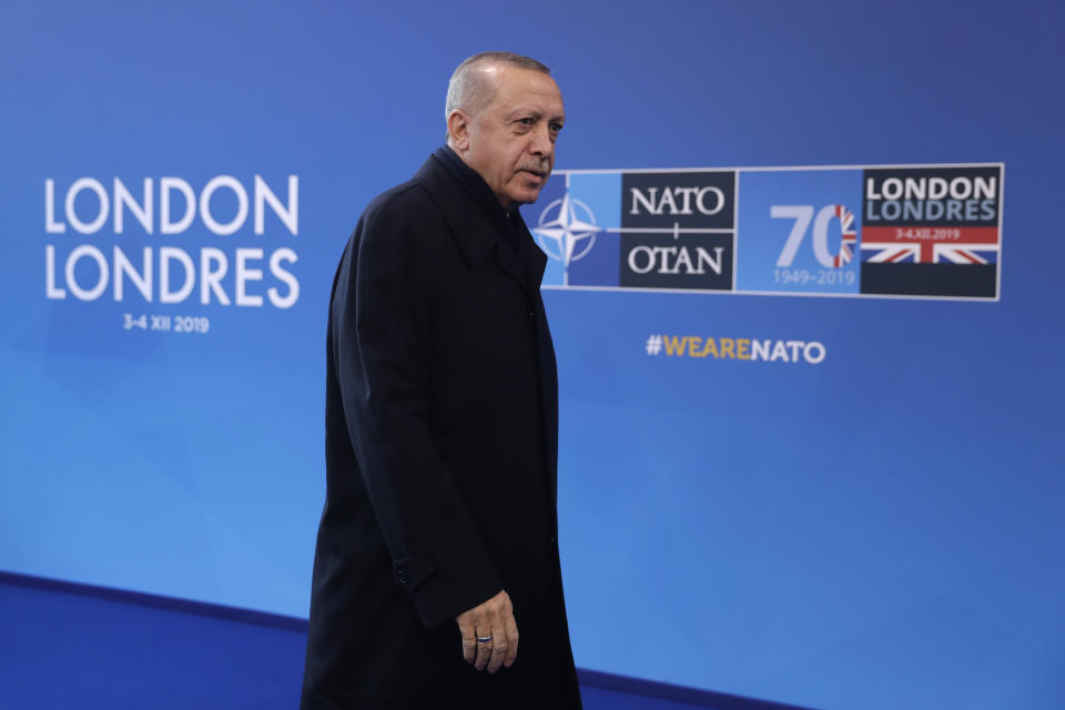 Turkish President Recep Tayyip Erdogan arrives for a NATO leaders meeting at The Grove hotel and resort in Watford, Hertfordshire, England, Wednesday, Dec. 4, 2019. As NATO leaders meet and show that the world's biggest security alliance is adapting to modern threats, NATO Secretary-General Jens Stoltenberg is refusing to concede that the future of the 29-member alliance is under a cloud. (AP Photo/Matt Dunham)