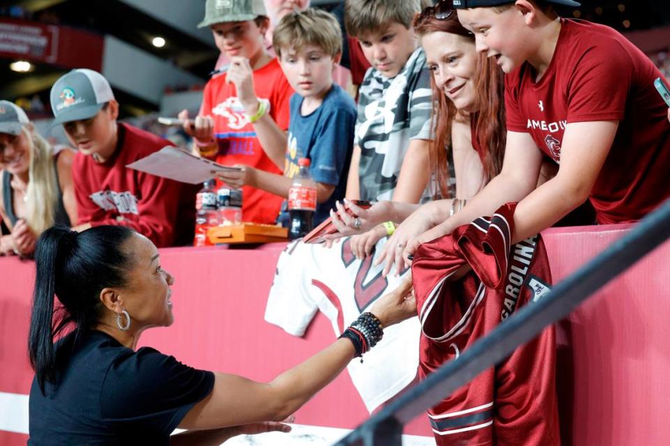 South Carolina head basketball coach Dawn Staley signs autographs during the Garnet & Black game at Williams Brice Stadium on Saturday, April 15, 2023.