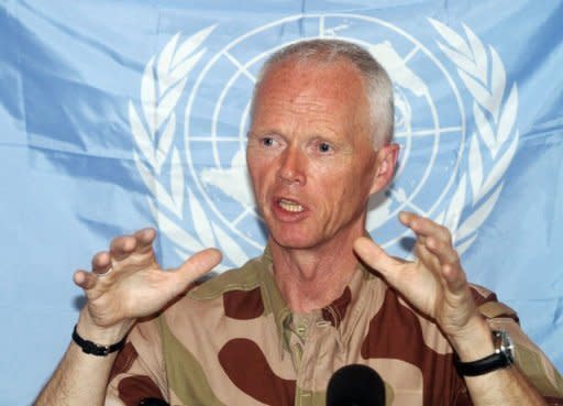 UN observer mission chief in Syria, Major General Robert Mood, addresses a news conference in the capital Damascus. UN observers suspended their mission to Syria, blaming intensifying violence as troops rained shells down on rebel bastions including Homs, where the opposition warned a massacre was imminent