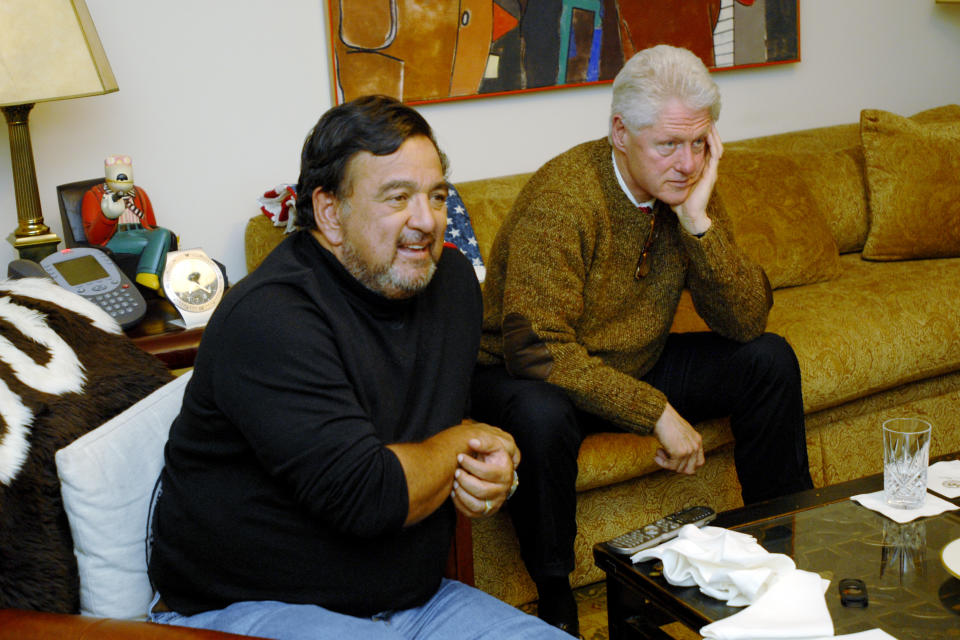 FILE - New Mexico Gov. Bill Richardson and former President Bill Clinton watch the Super Bowl at the Governor's Mansion in Santa Fe, N.M, Feb. 3, 2008. (AP Photo/The Santa Fe New Mexican, Rebecca Craig)