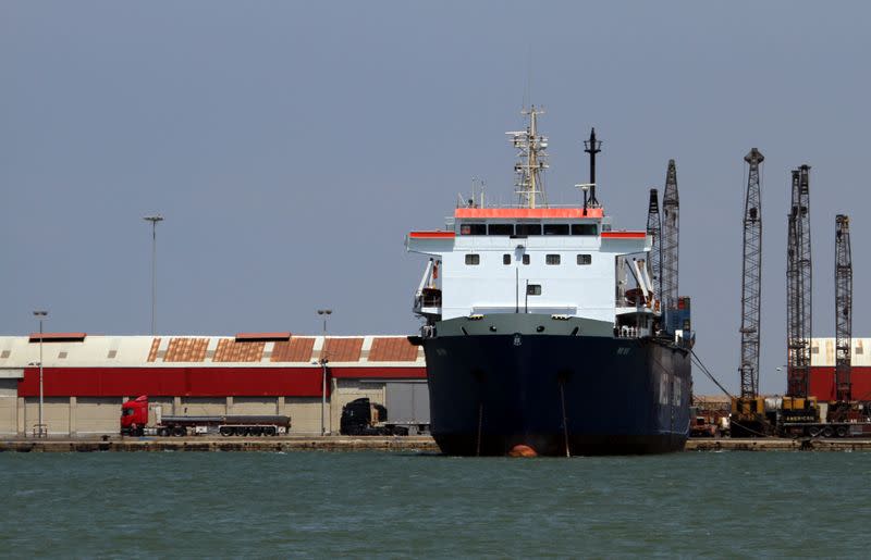 A cargo ship is seen at the port of Tripoli