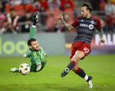 Toronto FC forward Federico Bernardeschi (10) scores against FC Dallas goalkeeper Maarten Paes, left, during first-half MLS soccer match action in Toronto, Saturday, May 4, 2024. (Christopher Katsarov/The Canadian Press via AP)