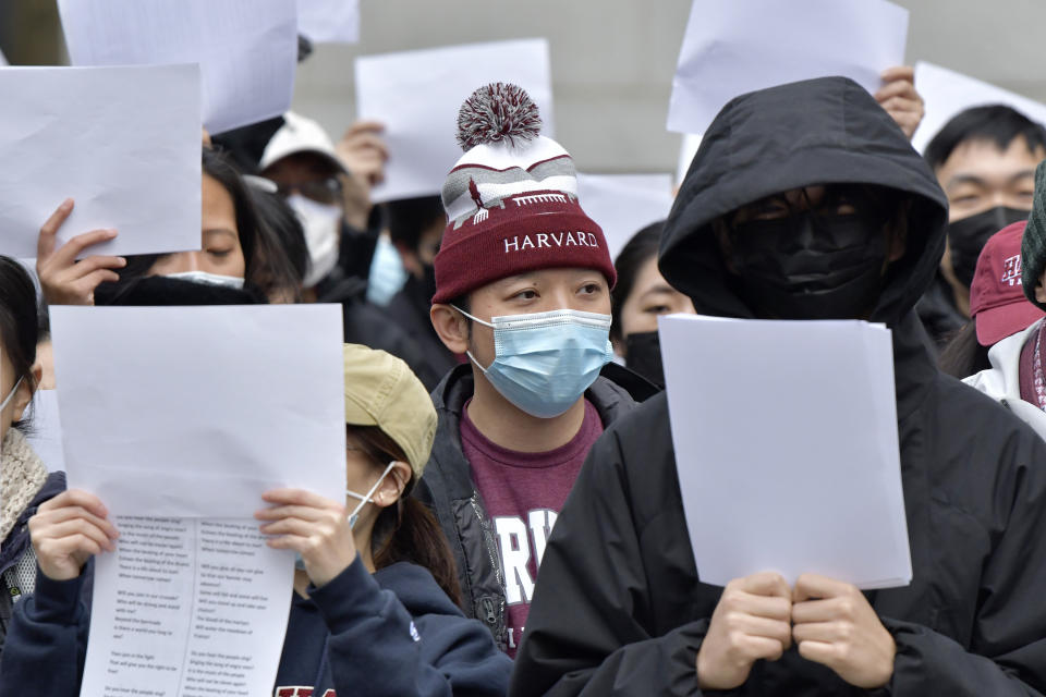 Dozens of students and faculty demonstrate against strict anti-virus measures in China, Tuesday, Nov. 29, 2022, at Harvard University in Cambridge, Mass. Protests in China, which were the largest and most wide spread in the nation in decades, included calls for Communist Party leader Xi Jinping to step down. (AP Photo/Josh Reynolds)