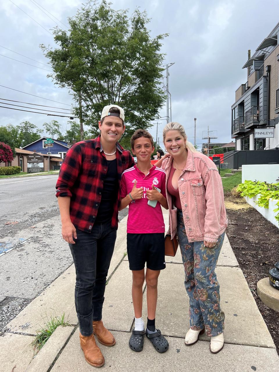 TikTok big tipper Lexy Burke, right, with her husband, Austin, who gave 11-year-old Niko $1,100 July 27, 2022, for one of the $3 glasses of lemonade Niko was selling along 12 South in Nashville, Tenn. The two videos of Niko got more than 30 million views in a week.