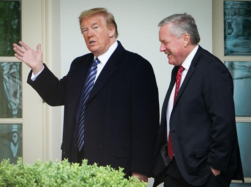 President Donald Trump walks with chief of staff Mark Meadows after returning to the White House from a May 2020 event at the World War II memorial in Washington, D.C.