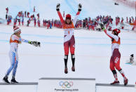 Alpine Skiing - Pyeongchang 2018 Winter Olympics - Women's Alpine Combined - Jeongseon Alpine Centre - Pyeongchang, South Korea - February 22, 2018 - Silver medallist Mikaela Shiffrin of the U.S., gold medallist Michelle Gisin of Switzerland and bronze medallist Wendy Holdener of Switzerland celebrate during the victory ceremony. REUTERS/Toby Melville