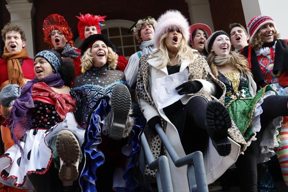 Harvard's Hasty Pudding Theatricals Woman of the Year Jennifer Coolidge, center right, participates in a kick dance after a parade in her honor, Saturday, Feb. 4, 2023, in Cambridge, Mass. (AP Photo/Michael Dwyer)