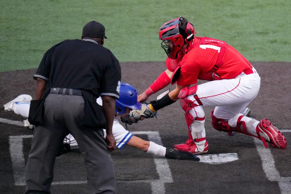 Highlands’ Zach DeSylva is called out at the plate as Beechwood catcher Carson Welch applies the tag in the fourth inning during the Kentucky Ninth Region championship game, Wednesday, May 24, 2023, at Thomas More Stadium in Florence, Ky.