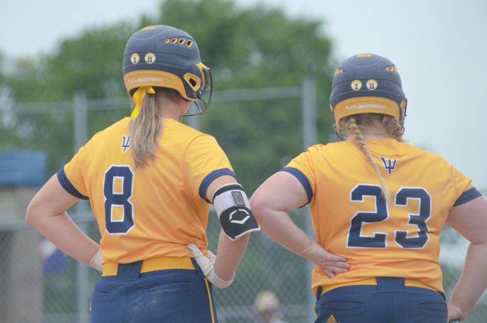 Alexis Kozlowski (left) and Taylor Moeggenberg (right) look on during the Division 2 Region 9 Finals on Saturday, June 11.