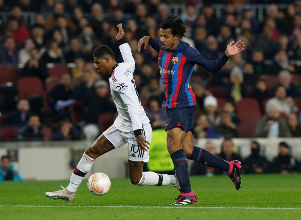 Marcus Rashford and Jules Kounde clash at the Nou Camp (Reuters)