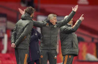 FILE - Manchester United's manager Ole Gunnar Solskjaer, centre, reacts as he watches play during the English Premier League soccer match between Manchester United and West Ham United at Old Trafford, Manchester, England, Sunday, March. 14, 2021. Manchester United has fired Ole Gunnar Solskjaer after three years as manager after a fifth loss in seven Premier League games. United said a day after a 4-1 loss to Watford that “Ole will always be a legend at Manchester United and it is with regret that we have reached this difficult decision." (AP Photo/Dave Thompson, Pool, File)