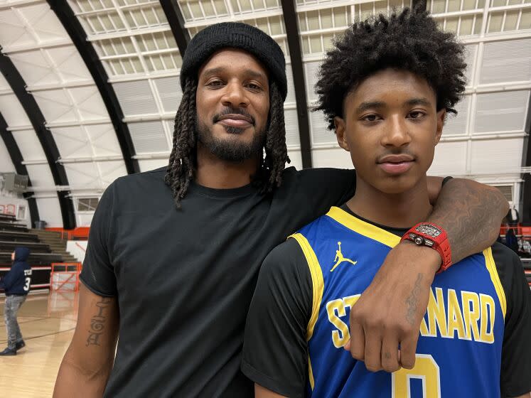 Trevor Ariza and his 14-year-old freshman son, Tajh, who scored 15 points for St. Bernard.