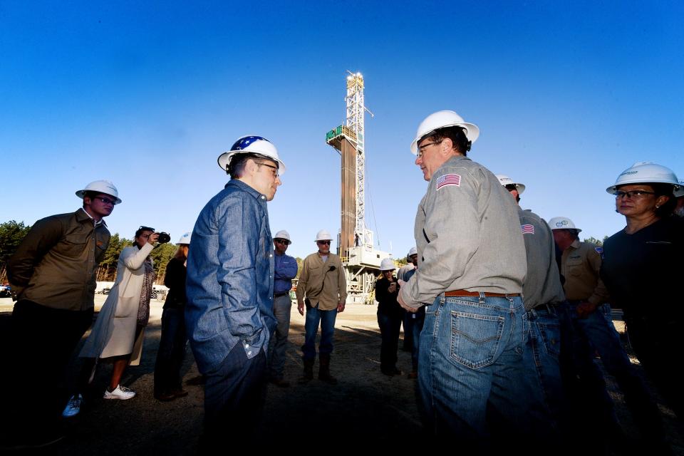 Speaker of the House Mike Johnson talks to Chesapeake Energy CEO and President Nick Dell'Osso at a natural gas rig in Mansfield, La., Friday morning, Feb. 23, 2024.