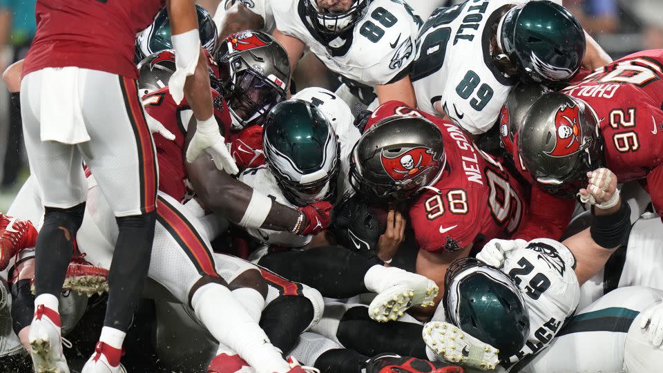 Philadelphia Eagles' Jalen Hurts (middle) scores a touchdown during the second half of a game against the Tampa Bay Buccaneers on September 25, 2023. - Chris O'Meara/AP