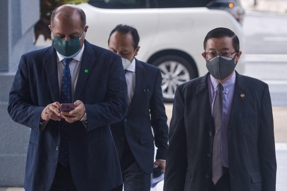 Former Penang chief minister Lim Guan Eng (right) and his lawyer Gobind Singh Deo is pictured at the Kuala Lumpur High Court September 22, 2021. — Picture by Miera Zulyana