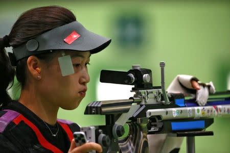 2016 Rio Olympics - Shooting - Preliminary - Women's 10m Air Rifle Qualification - Olympic Shooting Centre - Rio de Janeiro, Brazil - 06/08/2016. Yi Siling (CHN) of China (PRC) reacts. REUTERS/Jeremy Lee