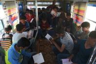 Children read from some of the 600 books that have been donated by Afghan publishers