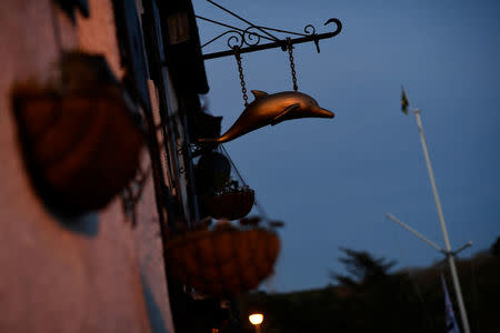 A sign hangs outside The Dolphin pub in Newton Ferrers, Devon, Britain April 11, 2017. REUTERS/Dylan Martinez