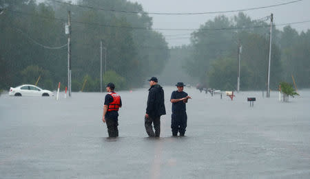 U.S. Coast Guard rescuers look for people and animals in floodwater caused by Hurricane Florence in Lumberton, North Carolina, U.S. September 16, 2018. REUTERS/Jason Miczek