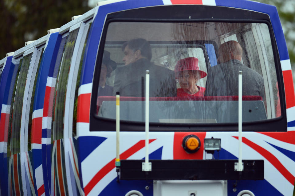 Queen Elizabeth II travels on a monorail during a visit to Chester Zoo as part of her tour of the North West on May 17, 2012 in Chester, England.