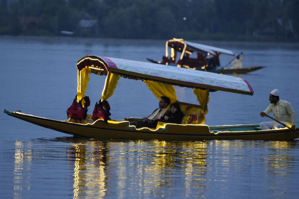 Delegates from the Group of 20 nations attending a tourism meeting enjoy boat ride at the Dal Lake in Srinagar, Indian controlled Kashmir, Monday, May 22, 2023. The meeting condemned by China and Pakistan is the first significant international event in Kashmir since New Delhi stripped the Muslim-majority region of semi-autonomy in 2019. (AP Photo/Mukhtar Khan)