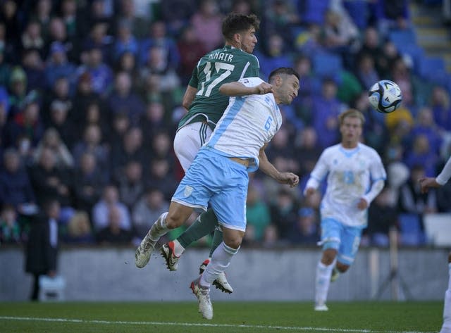 Paddy McNair (left) battles for the ball with Dante Rossi 