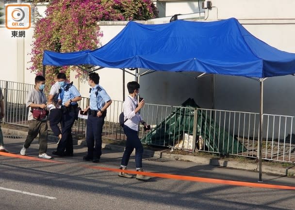 警方以帳篷遮蓋遺體。(梁國雄攝)
