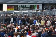 Football Soccer - Germany v Italy - International Friendly - Allianz-Arena, Munich, Germany - 29/3/16 Fans queue to get into the stadium REUTERS/Michaela Rehle