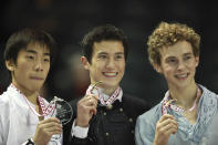 <p>Rippon (right) poses with his bronze medal alongside Patrick Chan of Canada (center) and Nobunari Oda of Japan (left) the silver medalist at Skate Canada International.<br>(Photo by Geoff Robbins/AFP/Getty Images) </p>