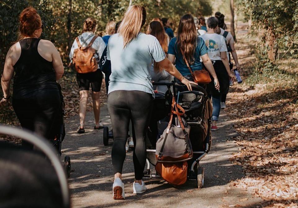 PHOTO: Moms walk together during an outdoor walk organized by The Mom Walk Collective. (The Mom Walk Collective)